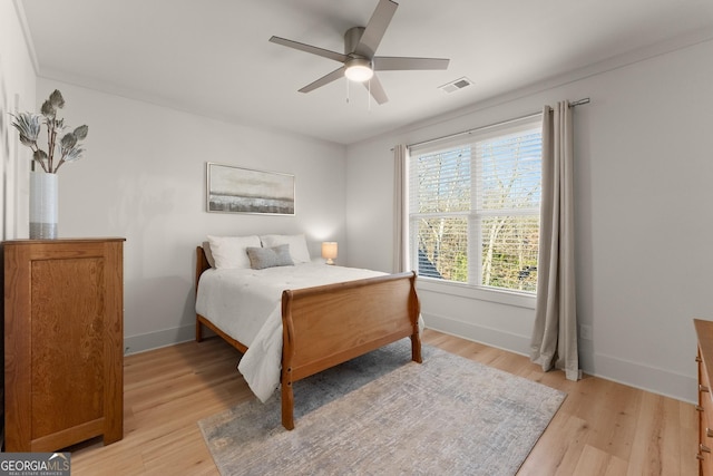 bedroom featuring ceiling fan and light hardwood / wood-style floors