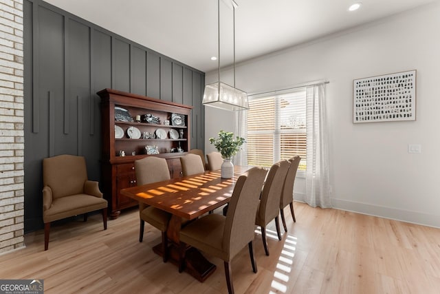 dining area featuring a chandelier and light wood-type flooring