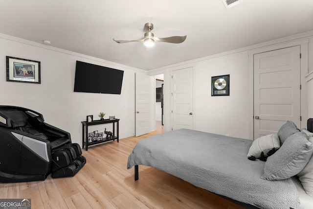 bedroom featuring wood-type flooring and ceiling fan