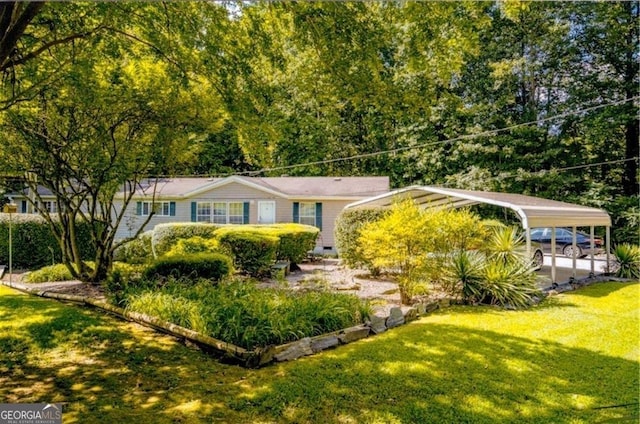 view of front of house with a carport and a front lawn