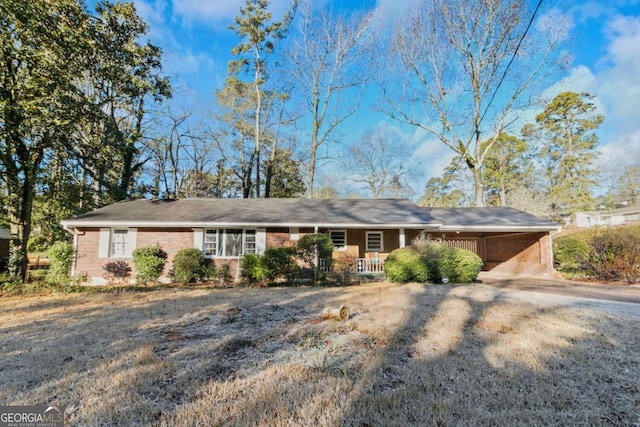 ranch-style home with a carport