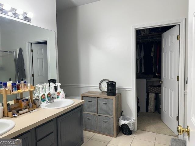 bathroom featuring tile patterned flooring and vanity