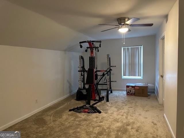 exercise area featuring lofted ceiling, light carpet, and ceiling fan