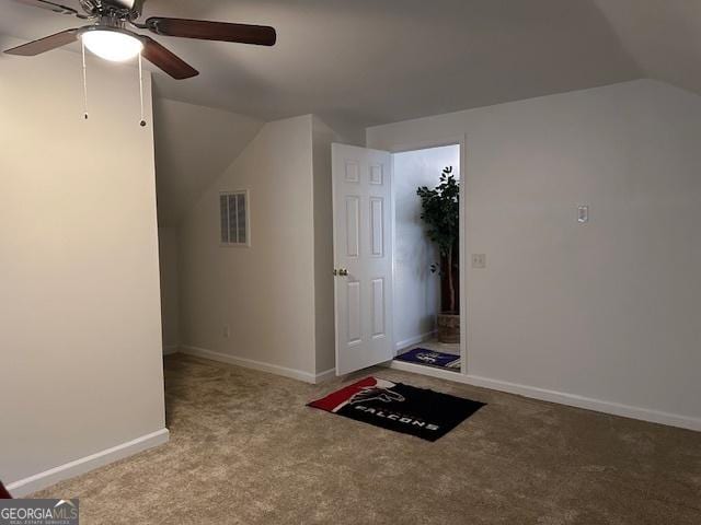 bonus room with vaulted ceiling, ceiling fan, and carpet flooring