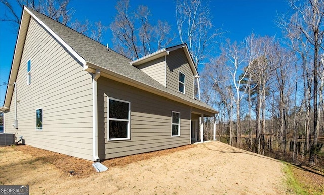 view of side of property featuring central AC unit