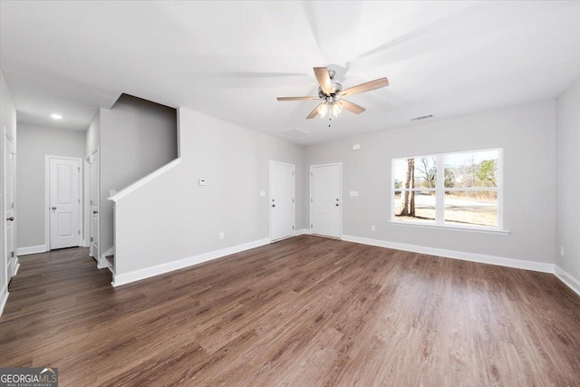 unfurnished room featuring ceiling fan and dark hardwood / wood-style floors