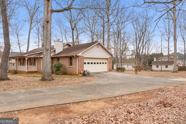 view of front of home featuring a garage and a porch