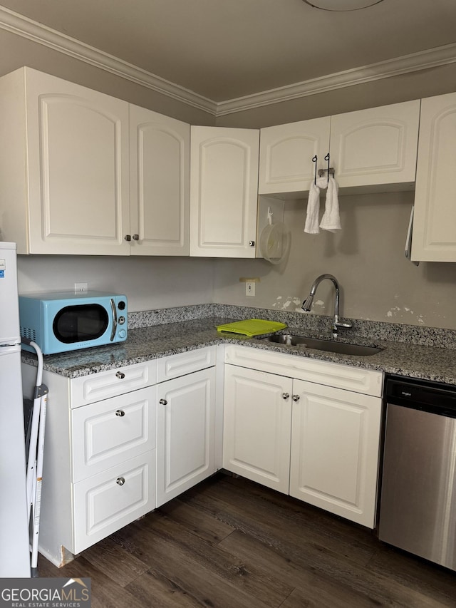 kitchen featuring dark hardwood / wood-style floors, white cabinetry, sink, dark stone countertops, and stainless steel dishwasher