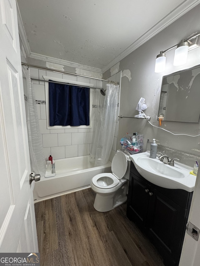 full bathroom featuring hardwood / wood-style floors, vanity, ornamental molding, toilet, and shower / bath combo with shower curtain