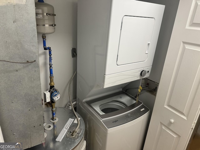 laundry room with stacked washer / dryer