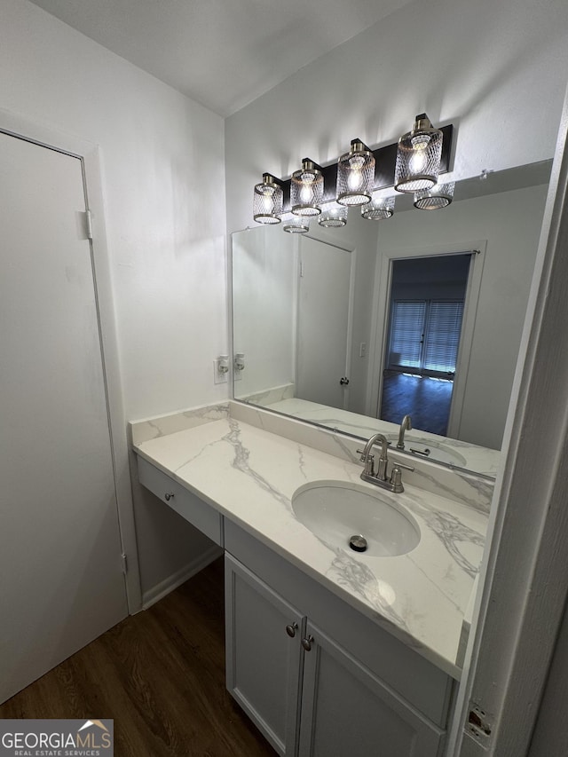 bathroom with vanity and wood-type flooring