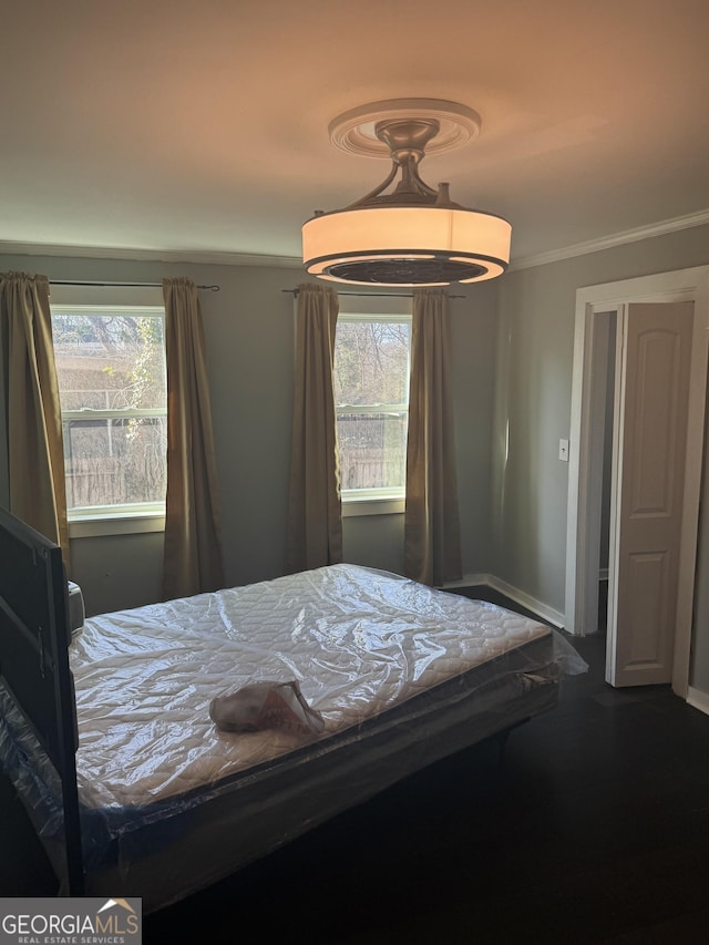 unfurnished bedroom featuring ornamental molding