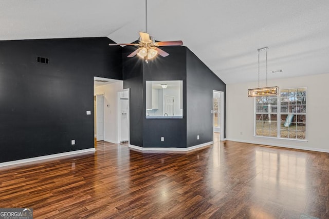 unfurnished living room featuring high vaulted ceiling, dark wood-type flooring, and ceiling fan