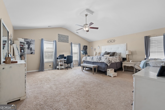 carpeted bedroom with vaulted ceiling and ceiling fan