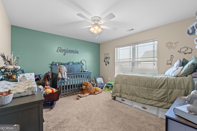 carpeted bedroom with ceiling fan