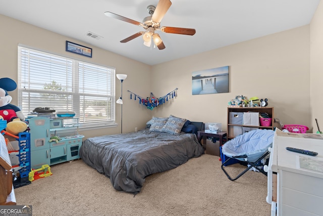 carpeted bedroom with ceiling fan