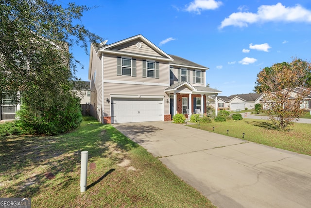 view of front of home with a garage and a front yard