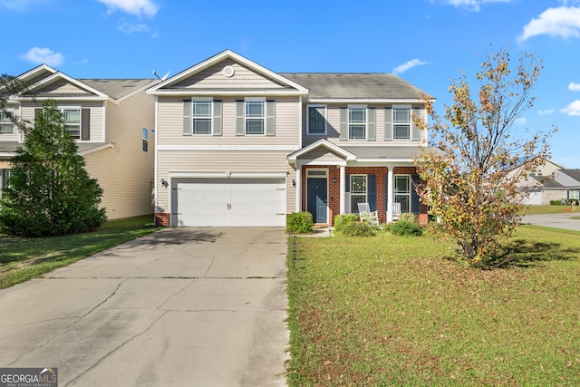 view of front of home featuring a garage and a front yard