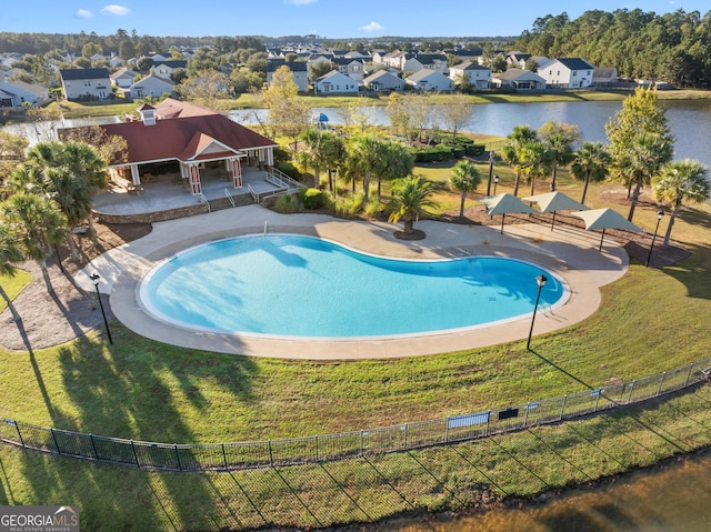 view of pool featuring a water view, a gazebo, a patio area, and a lawn