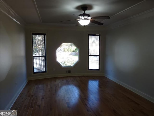 unfurnished room with hardwood / wood-style floors, plenty of natural light, ornamental molding, and ceiling fan