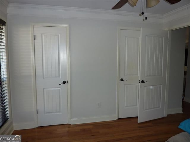 unfurnished bedroom featuring ornamental molding, dark hardwood / wood-style floors, and ceiling fan