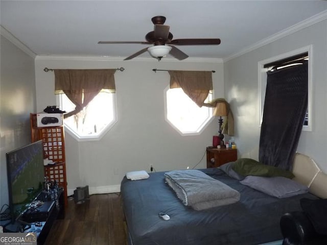 bedroom with crown molding, ceiling fan, dark hardwood / wood-style floors, and multiple windows