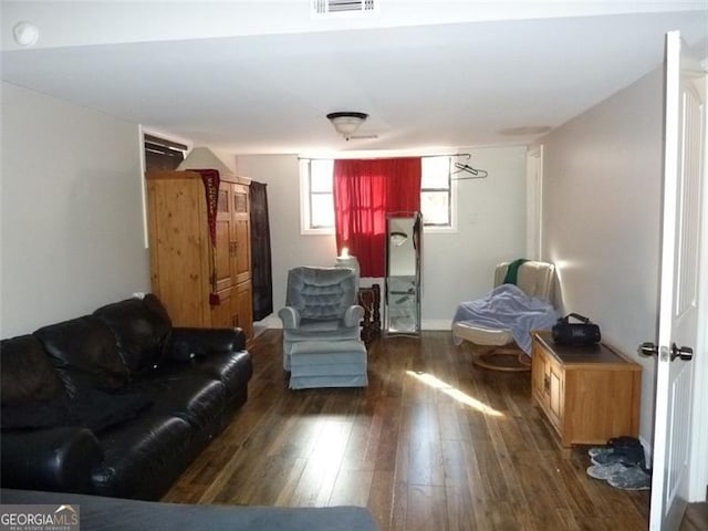 living room featuring dark hardwood / wood-style flooring