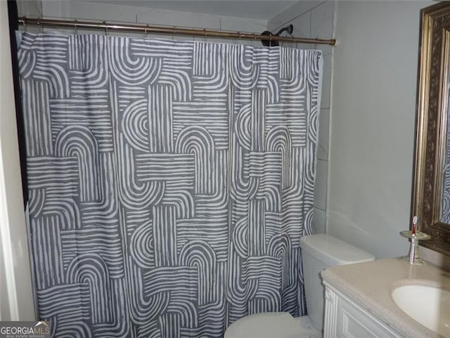 bathroom with vanity and toilet