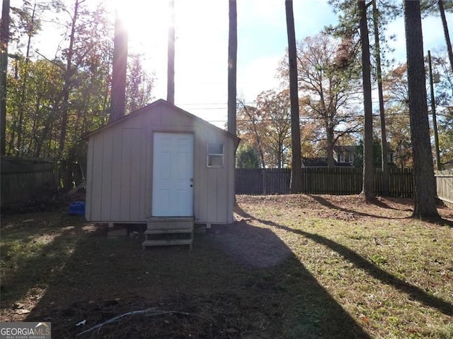 view of outbuilding featuring a yard