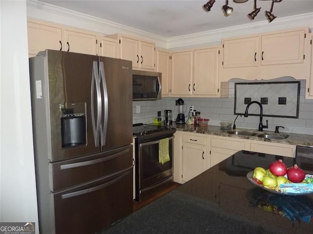 kitchen featuring appliances with stainless steel finishes, sink, backsplash, crown molding, and light stone countertops