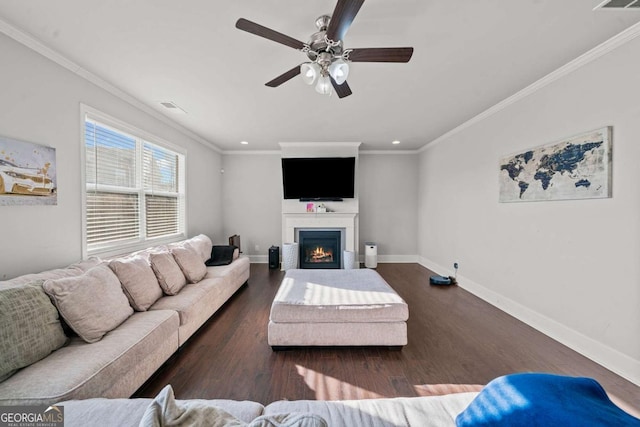 living room featuring dark hardwood / wood-style flooring, ornamental molding, and ceiling fan