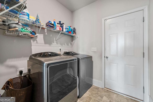 laundry area with independent washer and dryer