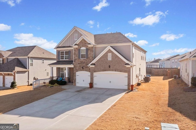 view of front of house featuring a garage and central air condition unit