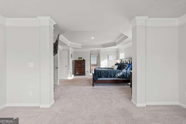 bedroom with a raised ceiling, ornamental molding, light carpet, and ornate columns