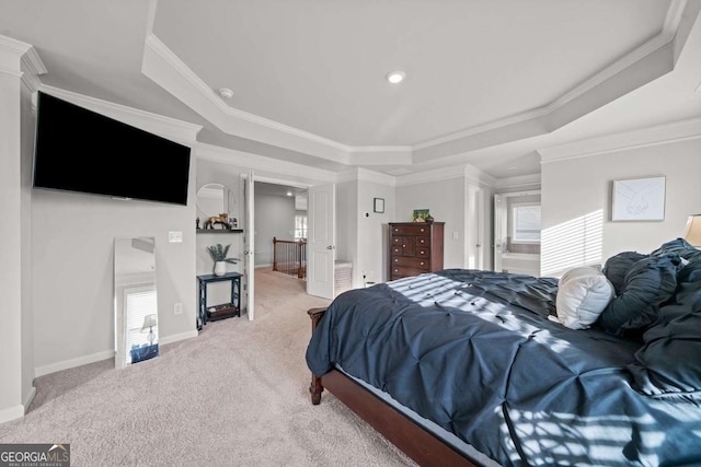 carpeted bedroom featuring a raised ceiling, ornamental molding, and multiple windows