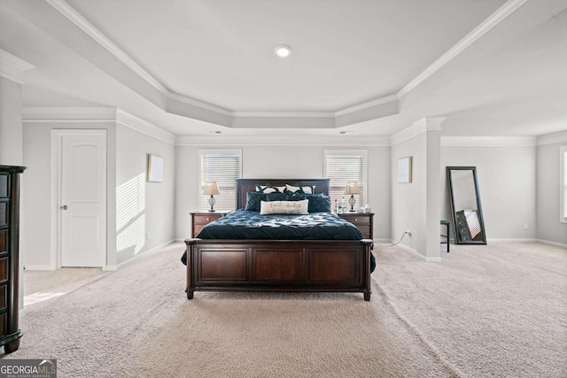 carpeted bedroom featuring multiple windows, crown molding, a raised ceiling, and ornate columns