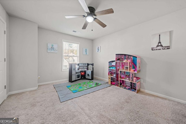 recreation room featuring carpet floors and ceiling fan