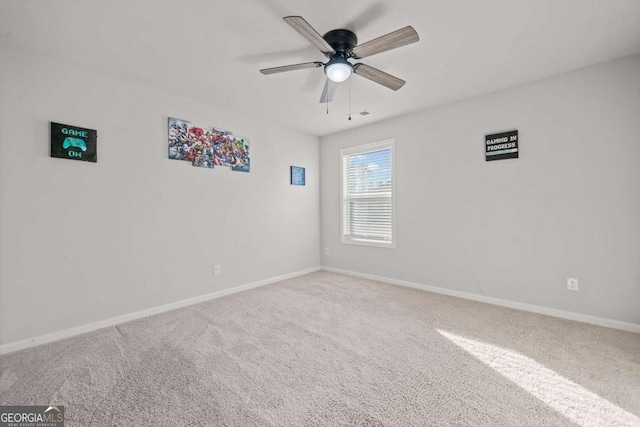 carpeted empty room with ceiling fan