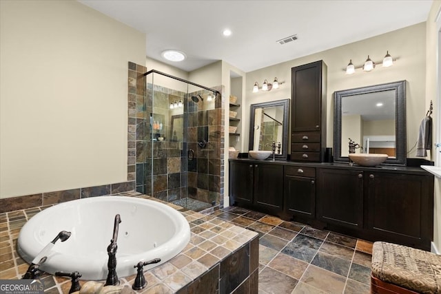 bathroom with vanity and separate shower and tub