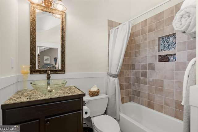 full bathroom with vanity, toilet, and shower / bath combo with shower curtain