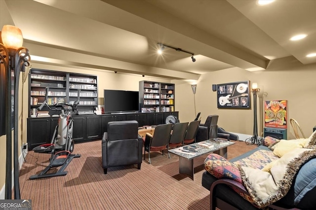 interior space featuring beam ceiling, carpet floors, and rail lighting