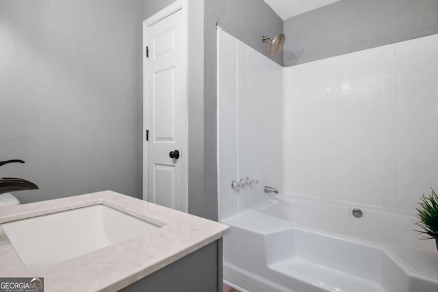 bathroom featuring vanity and shower / tub combination