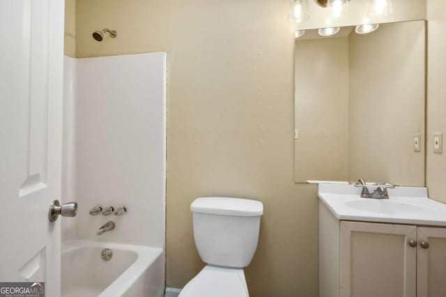 full bathroom featuring shower / bath combination, vanity, and toilet