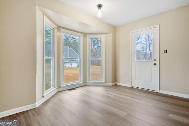 entrance foyer with light hardwood / wood-style flooring