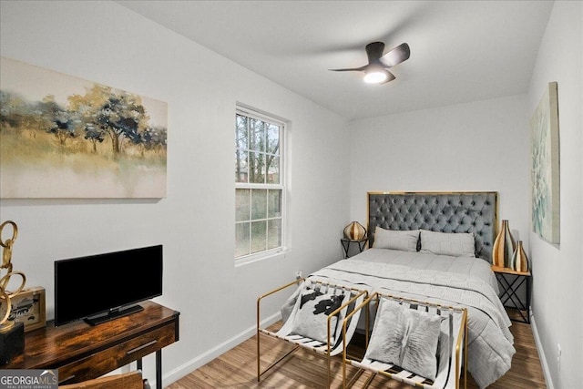 bedroom featuring hardwood / wood-style floors and ceiling fan