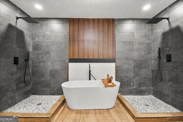 bathroom featuring wood-type flooring and independent shower and bath