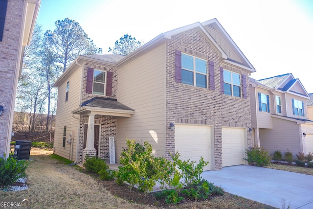 view of front of home featuring cooling unit and a garage