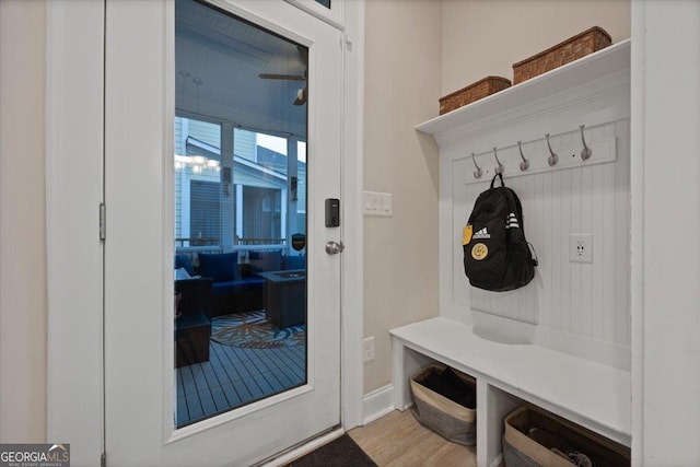 mudroom with light hardwood / wood-style floors