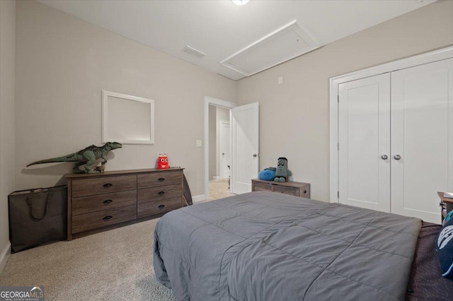 bedroom with carpet floors and a closet