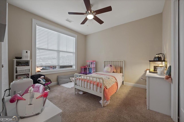 carpeted bedroom with ceiling fan